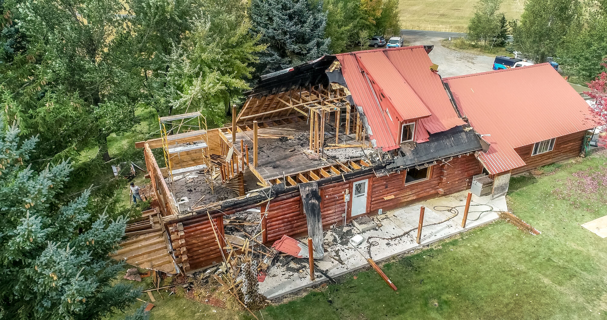 Aerial view of a home after a fire, now in need of fire damage restoration.